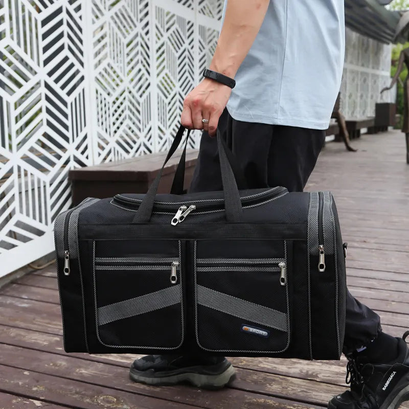 Grey-trim travel holdall carried by hand